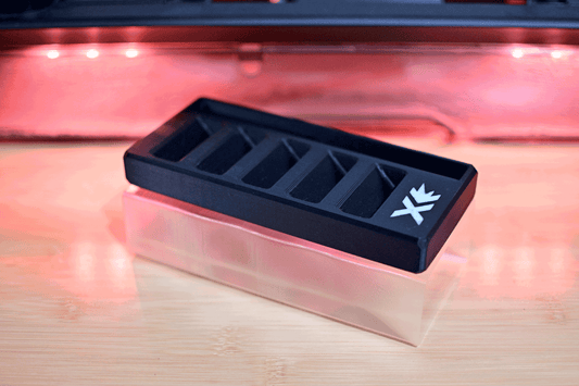 Empty Sparx Grinding Ring Organizer with five compartments on a semi-transparent base, ideal for neatly storing skate sharpening rings.
